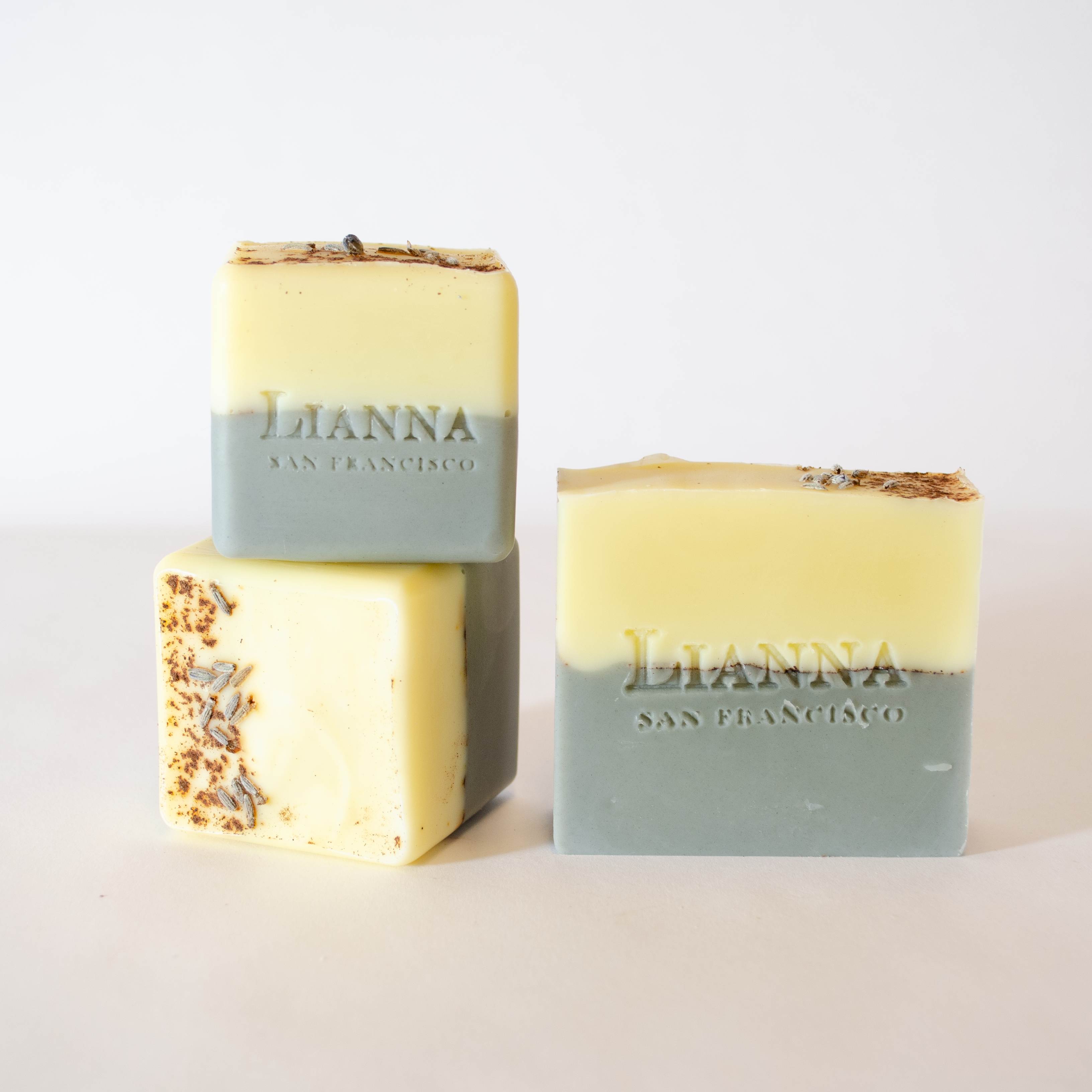 California olive oil soap with lavender cardamom essential oil, colored half white and half grey with a line of cinnamon and cardamom through. 